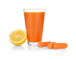 Glass of fresh carrot juice on white background