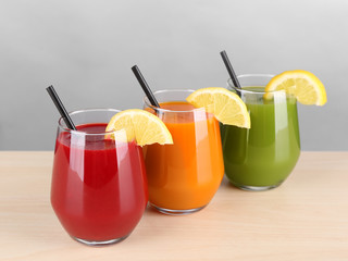 Glasses with various fresh juices on table