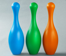 Bright bowling pins on light background