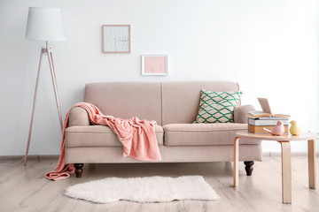 Modern room design with beige sofa