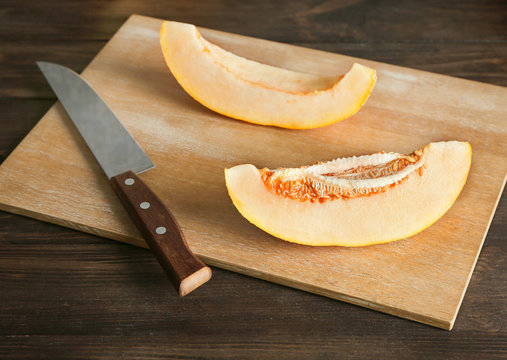 Ripe melon on wooden board