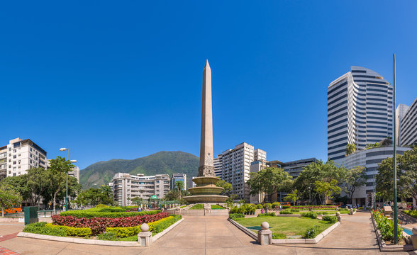 Panoramic view of Altamira's Obelisk on a sunny day with blue skies in Francia Square (A.k.a. Plaza Altamira), in venezuelan capital city Caracas, in 2017.