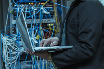 Engineer with toolboxs come to server room for work,check problem of network,repair server in the server room,thailand people,asian man