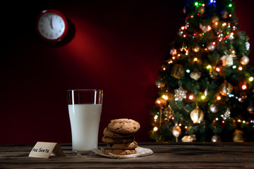 close up view of glass of milk with cookies on color back