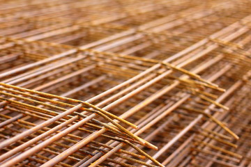 Steel bars for reinforced concrete. Closeup of Steel Bar. Geometric alignment of Re bars on construction site. Rusty is iron rust