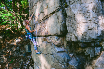 girl climber on a rock.