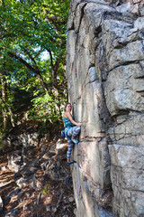 girl climber on a rock.