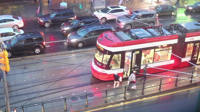 Time lapse of a streetcar in the city of Toronto at a rainy night. Province of Ontario, Canada