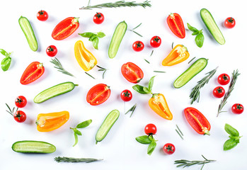 Fresh food pattern with cucumbers,  peppers,  tomatoes and herbs.