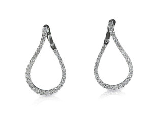 Diamond dangle drop earrings isolated on white