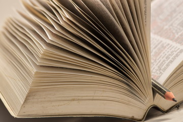 Pencil on open book, in the school year show intent to study and education concept