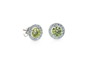 Green Peridot and diamond earrings isolated on white