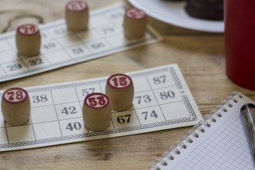 Bingo. Kegs and cards  with bingo on wood background