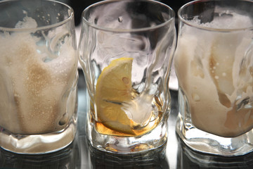 Three empty glasses from the soft drinks on the table in the cafe