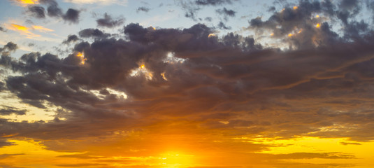 Fototapeta na wymiar fiery sunrise, only clouds and sky