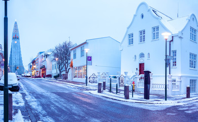 Old street in central Reykjavik at twilight, Iceland. in the background church of Hallgrimur. - obrazy, fototapety, plakaty