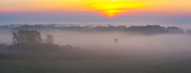 hunting tower in beautiful misty scenery