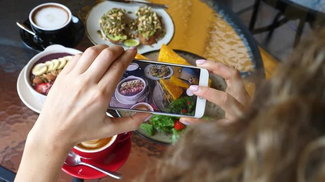 Female Hands Taking Photo Of Trendy Breakfast With Smartphone. Closeup. 4K. 