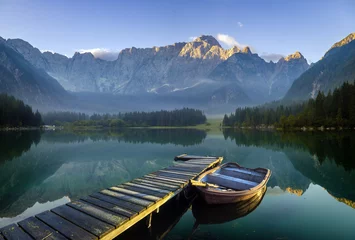 Foto op Canvas wooden bridge over a mountain lake © Mike Mareen