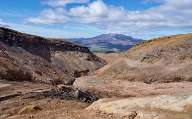 Walking route in the crater of the active volcano Mutnovsky on the Kamchatka Peninsula. Canyon at the entrance to the caldera of the volcano.
