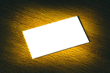 A white card on a wooden table