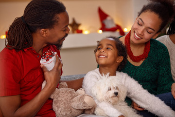 afro American family with presents together for Christmas.