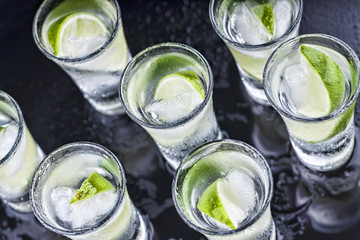 Cocktail. Vodka, gin, tequila with lime