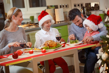 Family eating traditional Christmas dinner.