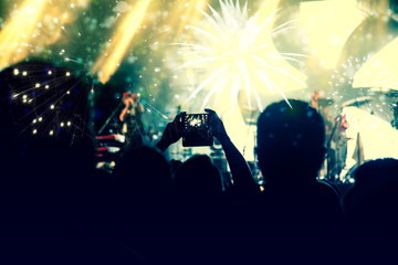 Fototapeta na wymiar new Year concept - cheering crowd and fireworks