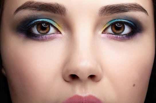 Closeup macro portrait of female face. Woman with evening beauty makeup