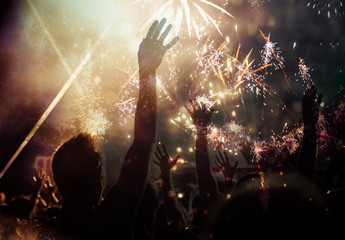 Fototapeta na wymiar new Year concept - cheering crowd and fireworks