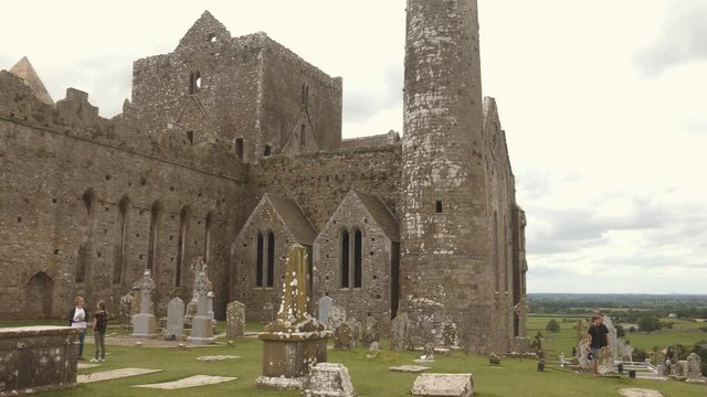 Panorama of the rock of Cashel, Ireland, visited by tourists
