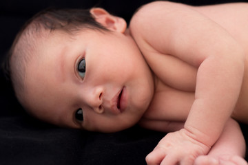 baby on black background