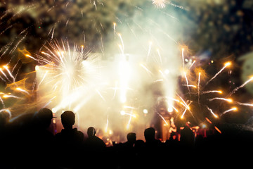 new Year concept - cheering crowd and fireworks