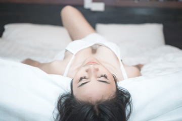 Fototapeta premium Portrait Asian sexy woman in the bed,Perfect portrait Thailand lady indoors,