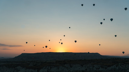 silhouettes of hot air balloons in Cappadocia, Turkey