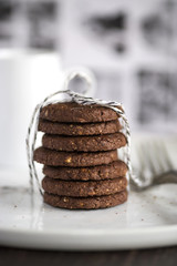 chocolat cookies home made gift with morning coffee close up photo with blur background