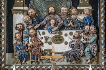 Jesus and the disciples at the last supper. Ancient altarpiece made by wood.