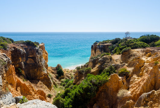Views of golden cliffs and the Atlantic ocean from the observation deck. District Faro, Algarve, Southern Portugal 