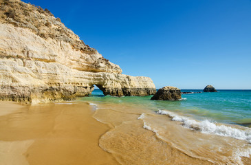 View of limestone cliffs of the Three Castles beach in Portimao, District Faro, Algarve, Southern...