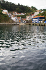 Fototapeta premium View from water to Cudillero, small fishing village in Asturias, Spain. 