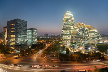 Fototapeta premium Beijing cityscape and famous landmark building in WangJing Soho at night in Beijing, China.