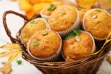 Appetizing and ruddy muffins with pumpkin and walnut.