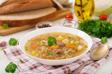 Traditional Russian soup with cabbage - sauerkraut soup.