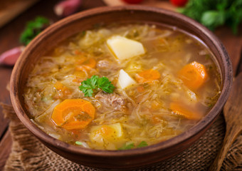 Traditional Russian soup with cabbage - sauerkraut soup.