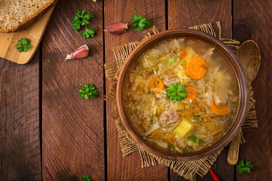 Traditional Russian soup with cabbage - sauerkraut soup. Flat lay. Top view