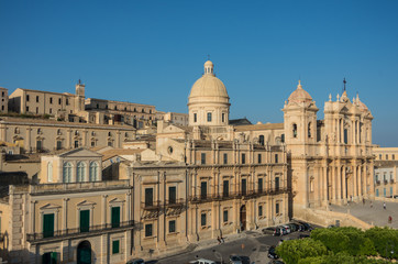 Fototapeta na wymiar The famous baroque cathedral of Noto in sunset. View from belltower of St. Charles Church. Sicily, Italy
