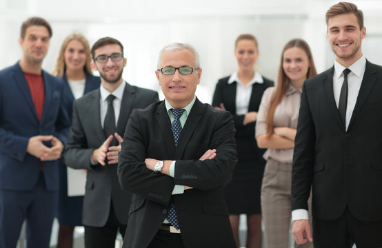 portrait of senior businessman and employees of the company.