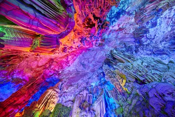 Papier Peint photo Guilin The Reed Flute Cave, natural limestone cave with multicolored lighting in Guilin, Guangxi, China.