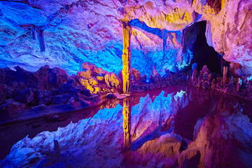 The Reed Flute Cave, natural limestone cave with multicolored lighting in Guilin, Guangxi, China.